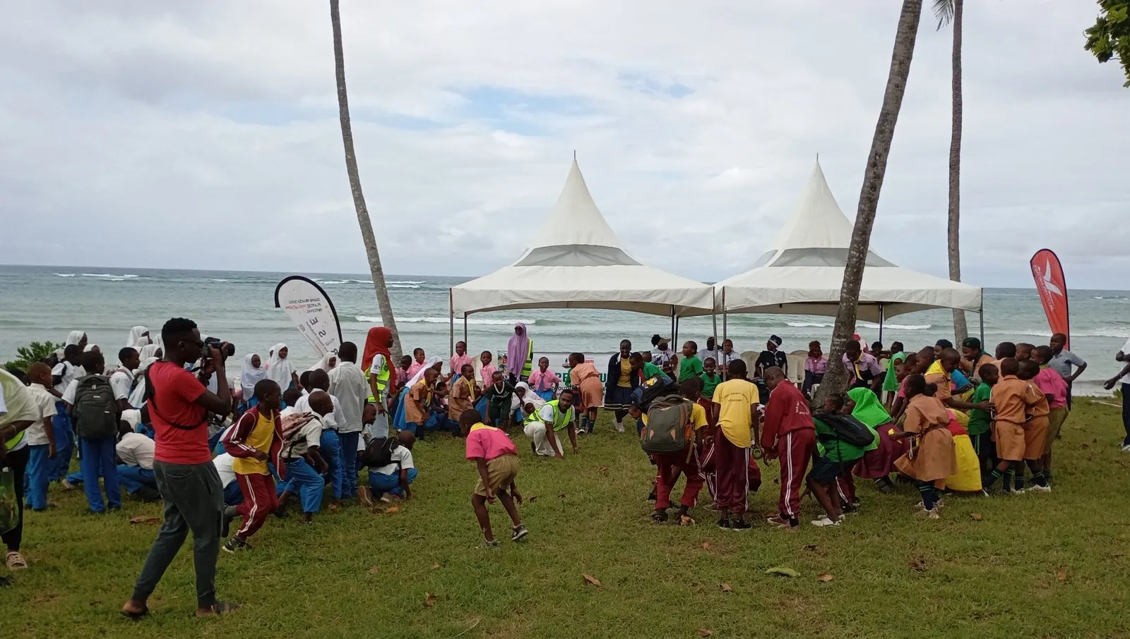 School pupils take part in a HERI environmental event on the beach in Diani